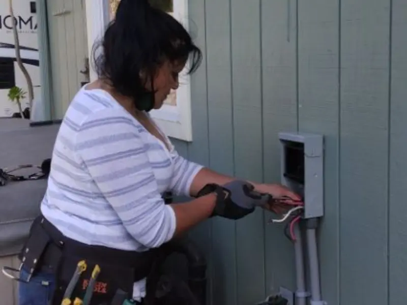 Licensed electrician wiring an exterior subpanel in Ocean Shores