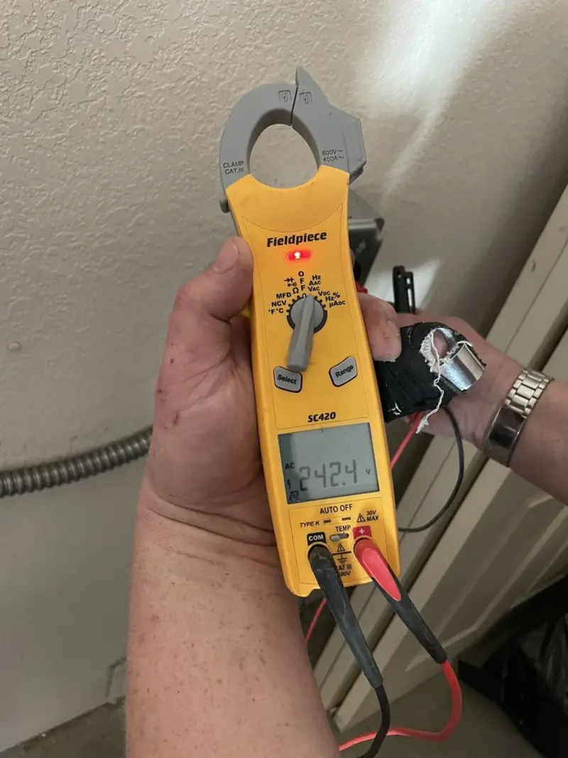 Voltage testing with clamp meter during Generator Installation in Ocean Shores